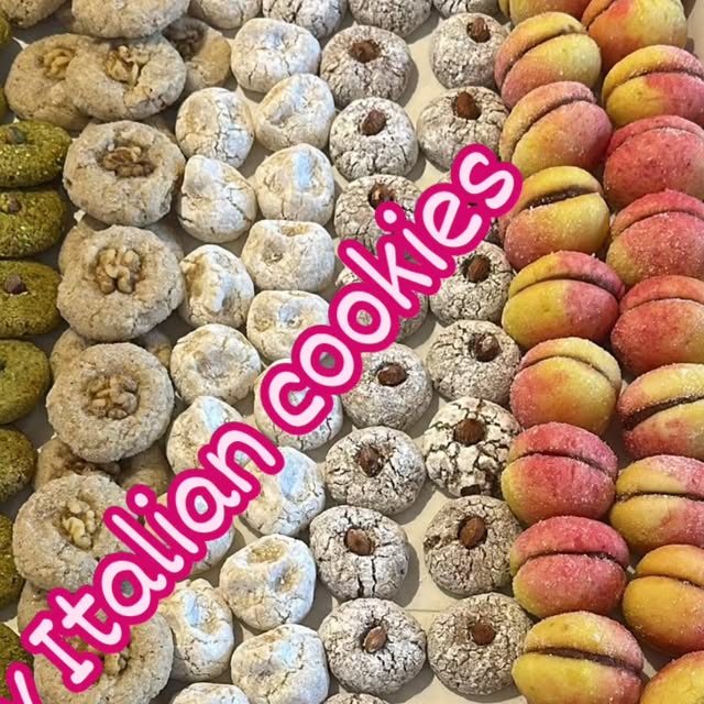 A tray of Italian cookies: pistachio crinkles, walnut amaretti and jam-filled peaches